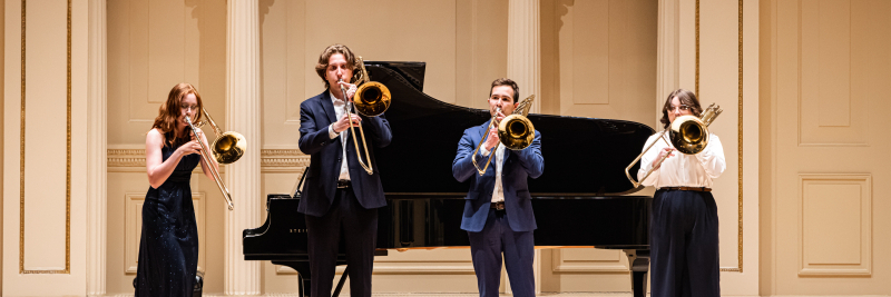 trombone quartet in performance hall